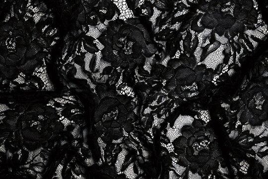 Black lace fabric texture with floral pattern design