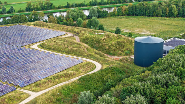 Aerial view of the solar thermal park in Dorkwerd ,Groningen, the Netherlands, showing large fields of solar panels and a circular thermal storage tank
