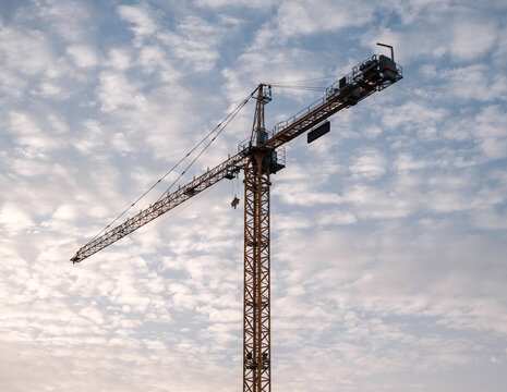 Tower Crane Against Cloudy Sky