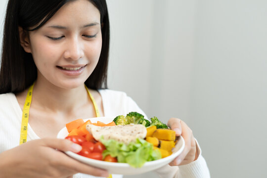 healthy food. Beautiful female girl smiling enjoy eat fresh vegetable salad on breakfast health. Happy asian woman good emotion. dieting, detox, diet, lose weight, clean eat, vegetarian, nutritionist