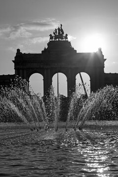 Brussels - The silhouette of Triumphal Arch in the Parc du Cinquantenaire and the fountain