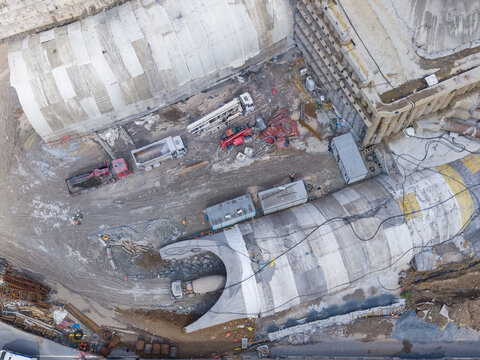 Aerial view of a construction site with concrete tunnels, heavy machinery, trucks, and building materials in Istanbul, Istanbul, Turkiye.