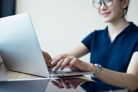 Business woman online working on laptop at modern workspace with digital tablet on table, surfing the net, remote work, online business concept