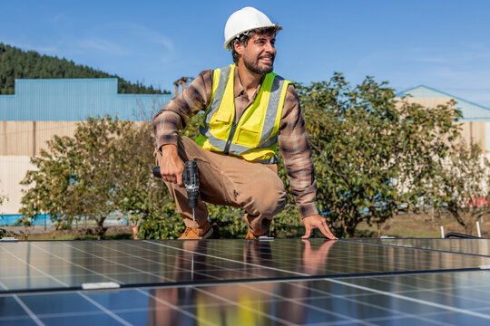 Solar engineer installing photovoltaic panels for renewable energy