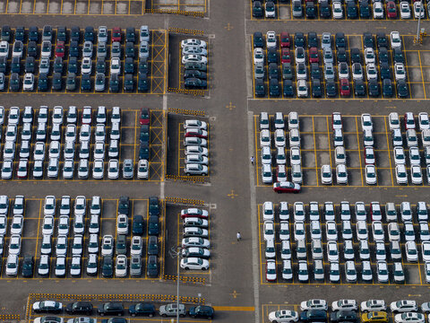 Aerial view of rows of new cars parked in the storage lot at the Skoda Auto Volkswagen India Pvt Ltd facility in Kharabwadi, Maharashtra, India.