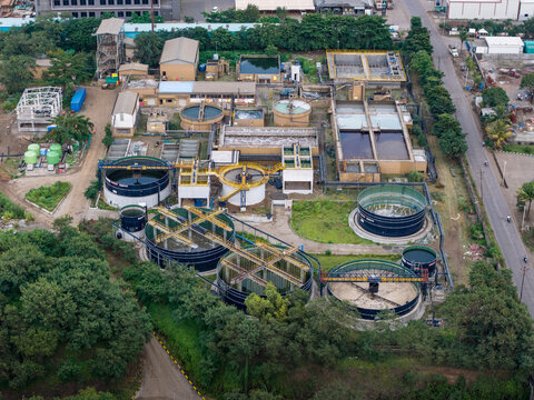 Aerial view of Remondis ETP Plant featuring circular water treatment tanks, industrial infrastructure, and surrounding greenery in Chakan, Maharashtra, India.