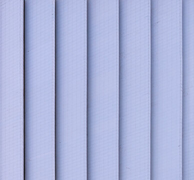 Aerial view of vertical architectural siding panels with clean lines and uniform texture in Chakan, Maharashtra, India.