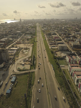 Aerial view of the Lekki-Epe Expressway with cars driving along the multi-lane highway surrounded by urban development and coastal scenery in Lekki, Lagos, Nigeria.