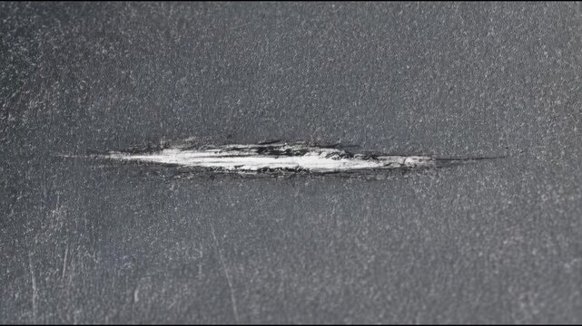 A black and white photo of a broken windshield
