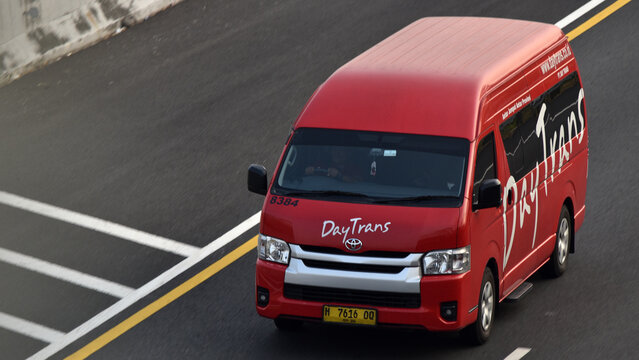 High angle shot of a red Toyota Hiace Commuter of DayTrans transport company
