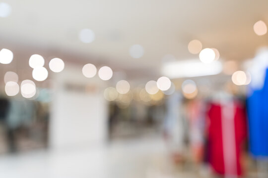 Out of focus blurred interior of clothing store with bokeh lights
