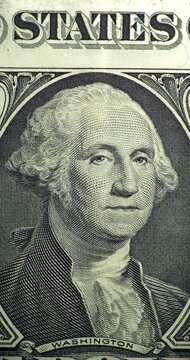 George Washington portrait stop motion animation. Portrait on one dollar bill moves through stop motion animation. George Washington engraved face changes position within printed currency design.