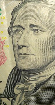 Alexander Hamilton portrait stop motion animation. Portrait on ten dollar bill moves through stop motion animation. Alexander Hamilton engraved face changes position within printed currency design.