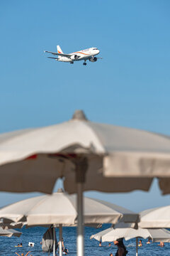 Airbus of Tus Airlines landing over Mackenzie Beach. Larnaca, Cyprus