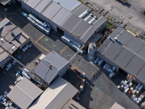 Kilsyth, VIC, Australia - 22 September 2026: Aerial view of industrial factory buildings with storage containers and loading areas.