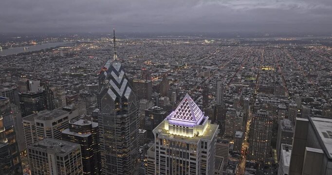 Philadelphia Pennsylvania Aerial v182 flyover Center City capturing skyscrapers in downtown and illuminated urban cityscape at dusk under dark gloomy sky - Shot with 5k Camera - Sept 28th 2023