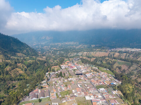 Aerial view of Wonokerto village nestled in the mountainous landscape of Sukorejo, East Java, Indonesia.