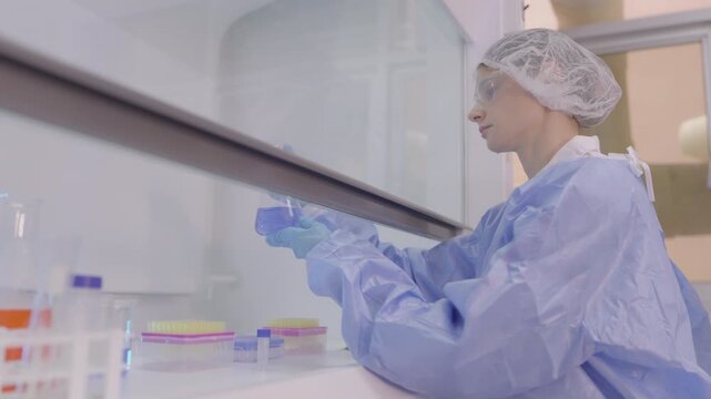 Woman medic works in bacteriological laboratory
