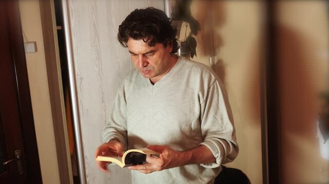 A man is reading a sacred book, and what he reads inspires him, giving him strength and hope.
