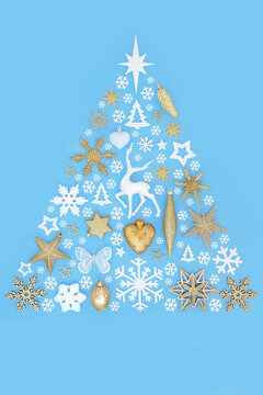 Christmas tree shape decoration fantasy art with gold white decorations on blue. Festive Xmas symbol abstract design for Xmas season. Greeting card.