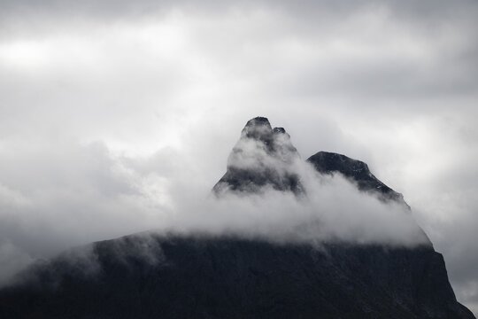 Mountain peak rising from clouds, near &Aring;ndalsnes or Andalsnes, Rauma municipality in M&oslash;re og Romsdal province, Norway