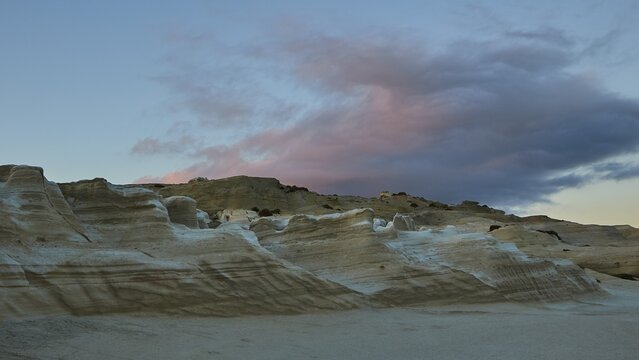 Morning light, light blue sky, blue-grey wools, pink illuminated, tufa rock, tufa rocks, Sarakiniko Beach, Milos Island, Cyclades, Greece