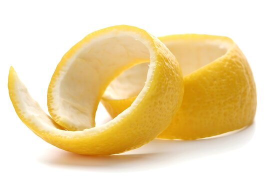 Fresh lemon peel spiral cut from organic citrus fruit