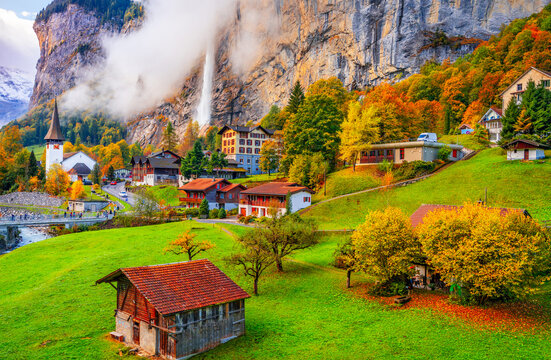 Lauterbrunnen, Switzerland on a beautiful morning with patchy fog during autumn season 473
