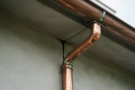 Copper gutter green patina at leak seam