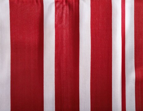 red and white striped fabric background showing a textured textile weave for various design purposes highlighting the vertical pattern and classic color combination