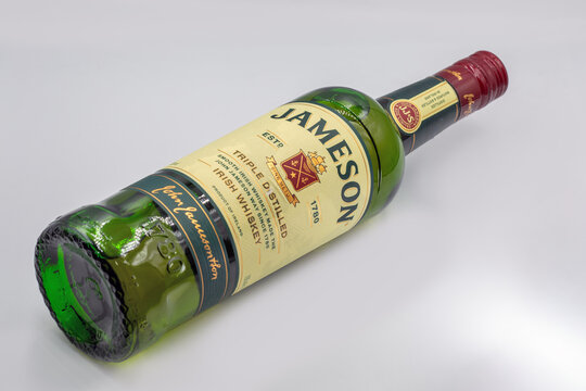 Jameson Triple Distilled Irish Whiskey bottle closeup on white.