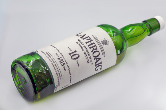Laphroaig 10 year Islay whisky bottle closeup on white.