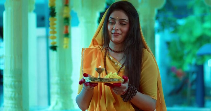Indian Saint Mirabai Performing Aarti and Offering Prayers to Lord Krishna. Traditional Rajasthani devotional worship, Hindu temple rituals, and spiritual bhakti.