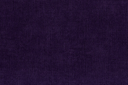 Dark purple fabric texture with visible fine weave and subtle tonal variations, ideal for textile backgrounds, design, decor and creative projects.