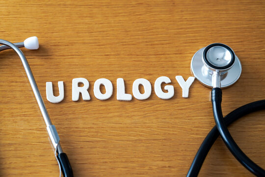 urology. Word formed with wooden letters, accompanied by a medical stethoscope.