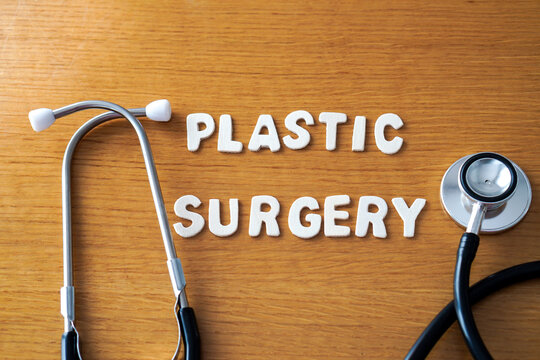 plastic surgery. Words formed with wooden letters, accompanied by a medical stethoscope.