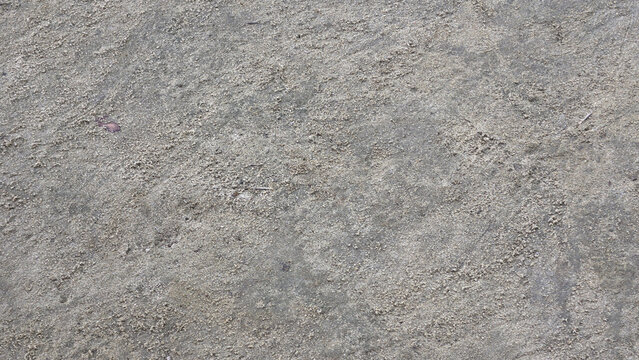 Rough grey concrete ground texture with natural weathered surface for architectural background