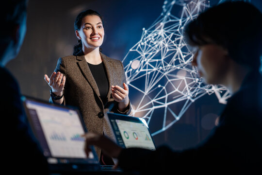 Confident Businesswoman Presenting Data Science Insights with Futuristic Network Visualization