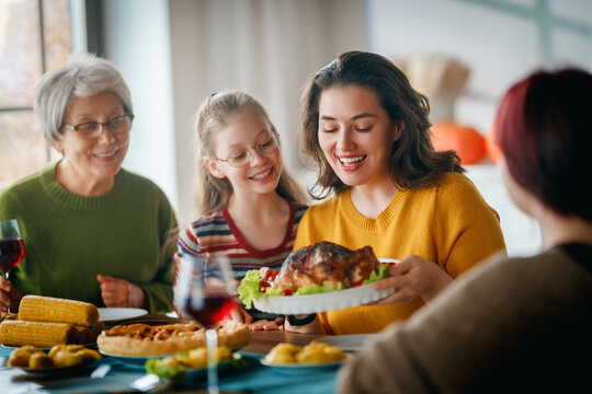 Happy Family Gathering Sharing Festive Dinner and Celebrating Together at Home