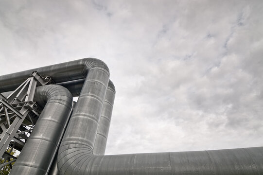 close-up of a pipeline against a gray sky