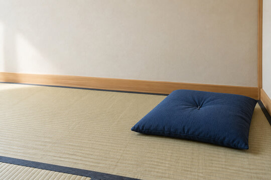 Indigo zabuton cushion on tatami floor with copy space