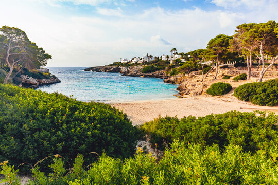 Sandy beach and turquoise cove at Cala Esmeralda, Mallorca, Spain.