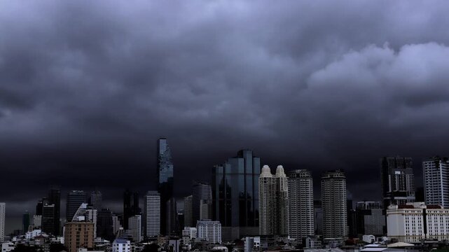 Time-Lapse of a Dramatic Bangkok cityscape beneath a vast layer of dark rain clouds.