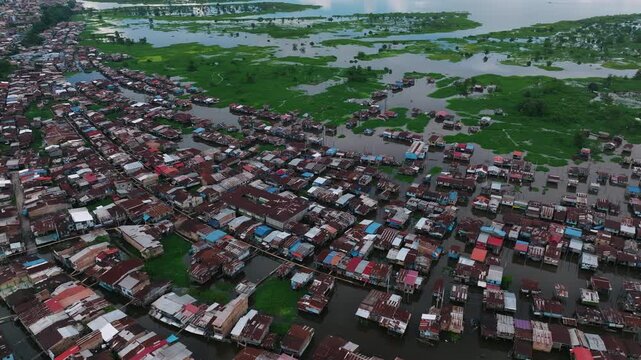 Flooded Riverside Settlement and Tropical Wetlands Aerial View