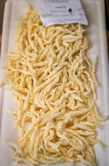 Fototapeta premium Fresh trofie, traditional Ligurian pasta at a farmers market in Sanremo, Italy