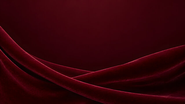 Elegant deep red velvet fabric background with soft drapes and folds, creating a luxurious and smooth texture for professional design projects.