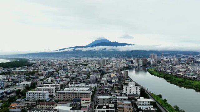 Aerial drone footage of Mount Fuji and cityscape in Numazu, Shizuoka, Japan
