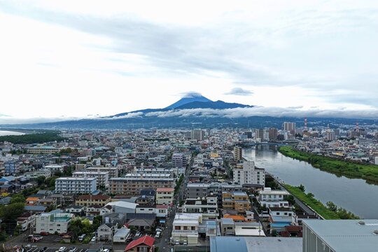 Aerial drone photo of Mount Fuji and urban area in Numazu, Shizuoka