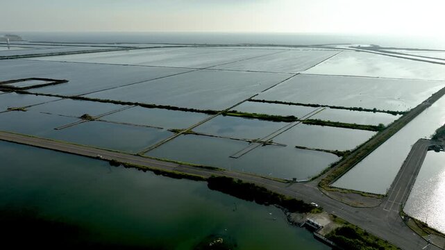 Aerial shot of large fish ponds along the coast of Taiwan used for farming fish and shrimp.