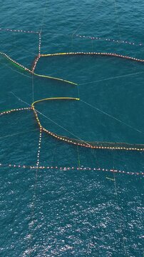 Aerial of a permanent fish nets off the coast of Taiwan. Vertical video.
